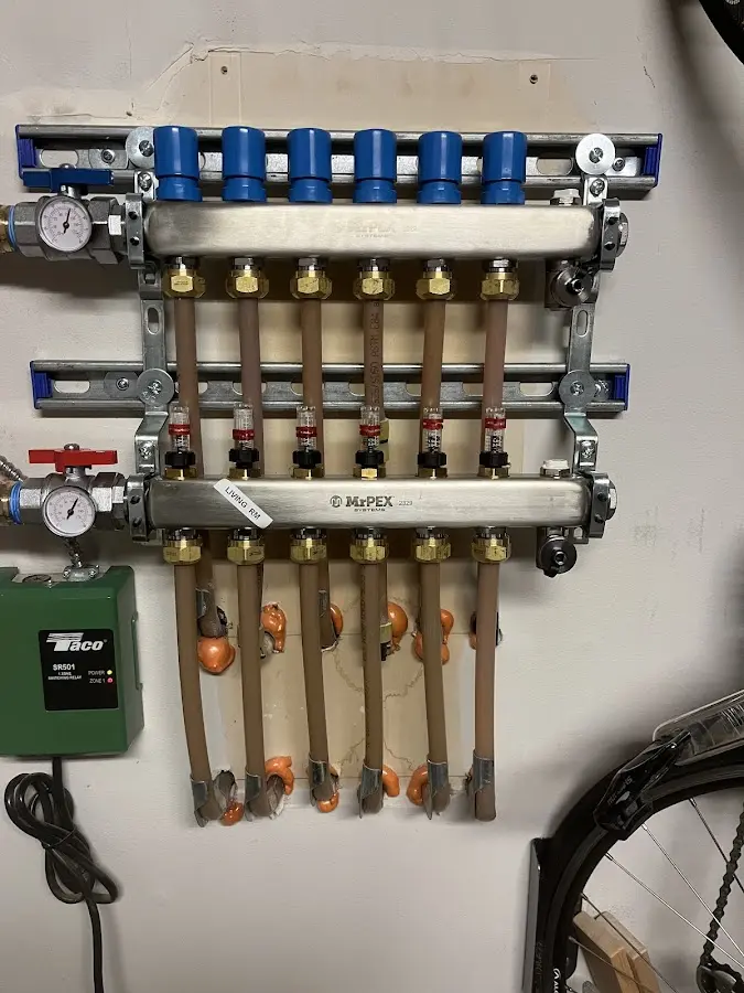 Plumber performing Gas Line Installation at a residential property in Hubbardston